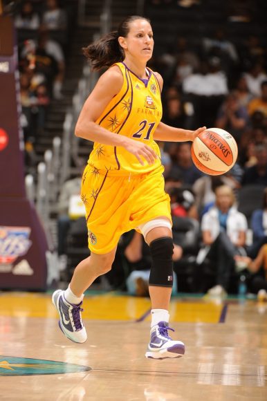 LOS ANGELES - AUGUST 28:  Ticha Penicheiro #21 of the Los Angeles Sparks brings the ball up court against the Seattle Storm during Game Two of the Western Conference Semifinals during the 2010 WNBA Playoffs on August 28, 2010 at Staples Center in Los Angeles, California. The Storm won 81-66. Copyright 2010 NBAE   (Photo by Andrew D. Bernstein/NBAE via Getty Images)