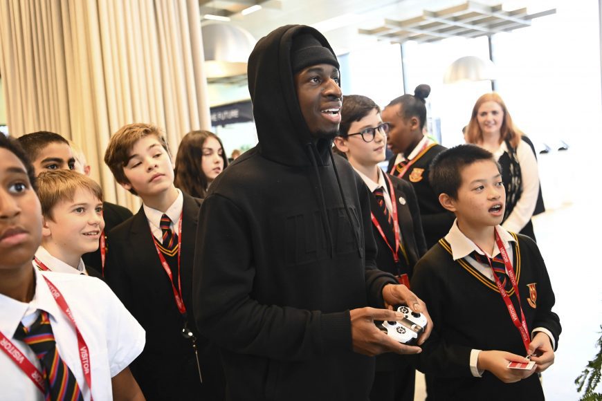 Youtuber Tobi Brown flies a drone with pupils from Prendergast Ladywell School, at Amazon’s Jobs Fair of the Future event, marking the launch of the ‘Alexa Young Innovator Challenge’, an AI-inspired educational programme for secondary school pupils, at their offices in London. Issue date: Tuesday November 8, 2022. PA Photo. New research reveals that computer science and AI related roles could contribute £71 billion a year to the UK economy. Photo credit: Matt Crossick/PA Wire.