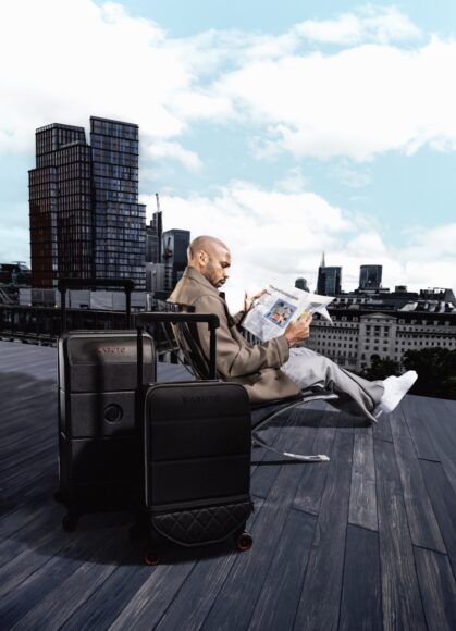 Kabuto x Thierry Henry Lifestyle Image Thierry Henry on London rooftop PORTRAIT with Kabuto x Thierry Henry Expandable Leather Carry-on and Trunk Large